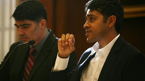 two men on panel discussion