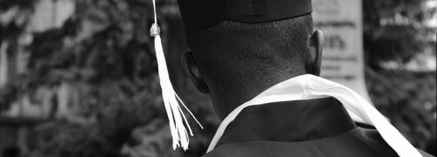 student with graduation cap from the back