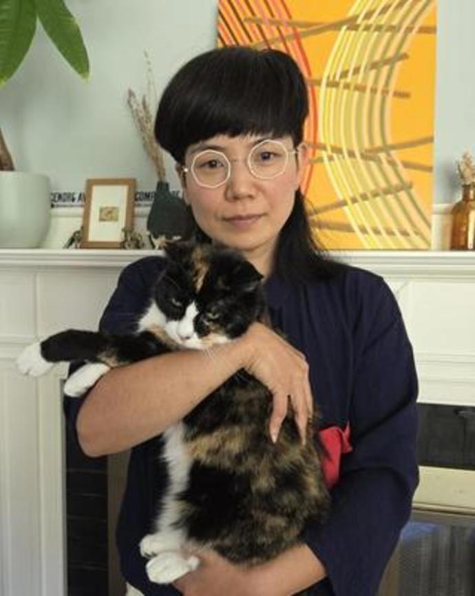Annabel Kim headshot with cat