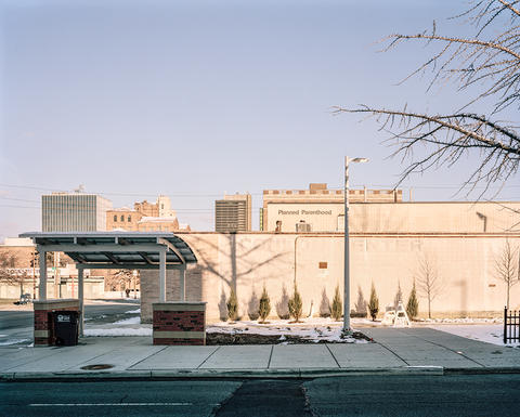 Planned Parenthood building with bus stop in front